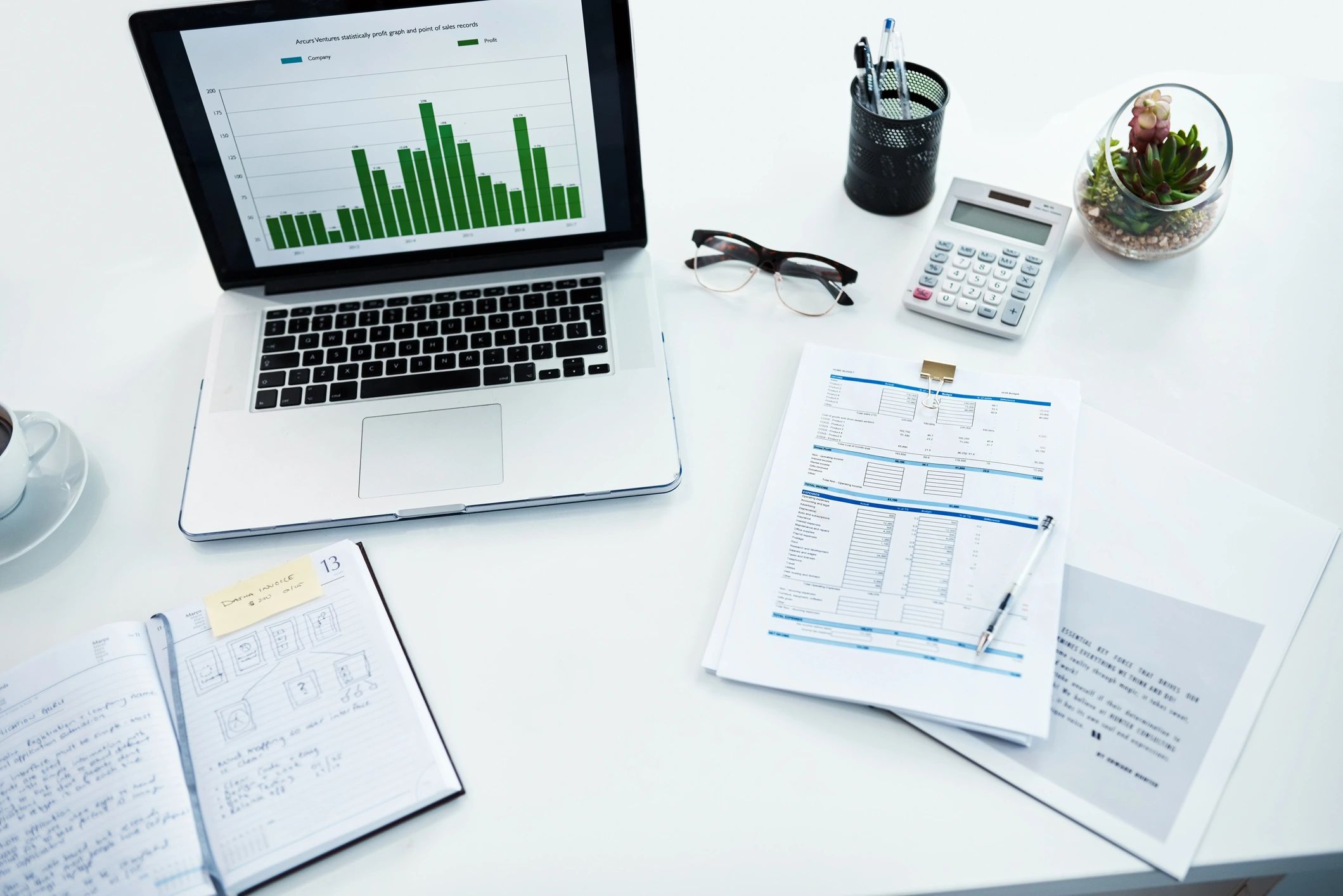 Desk with calculator and financial documents