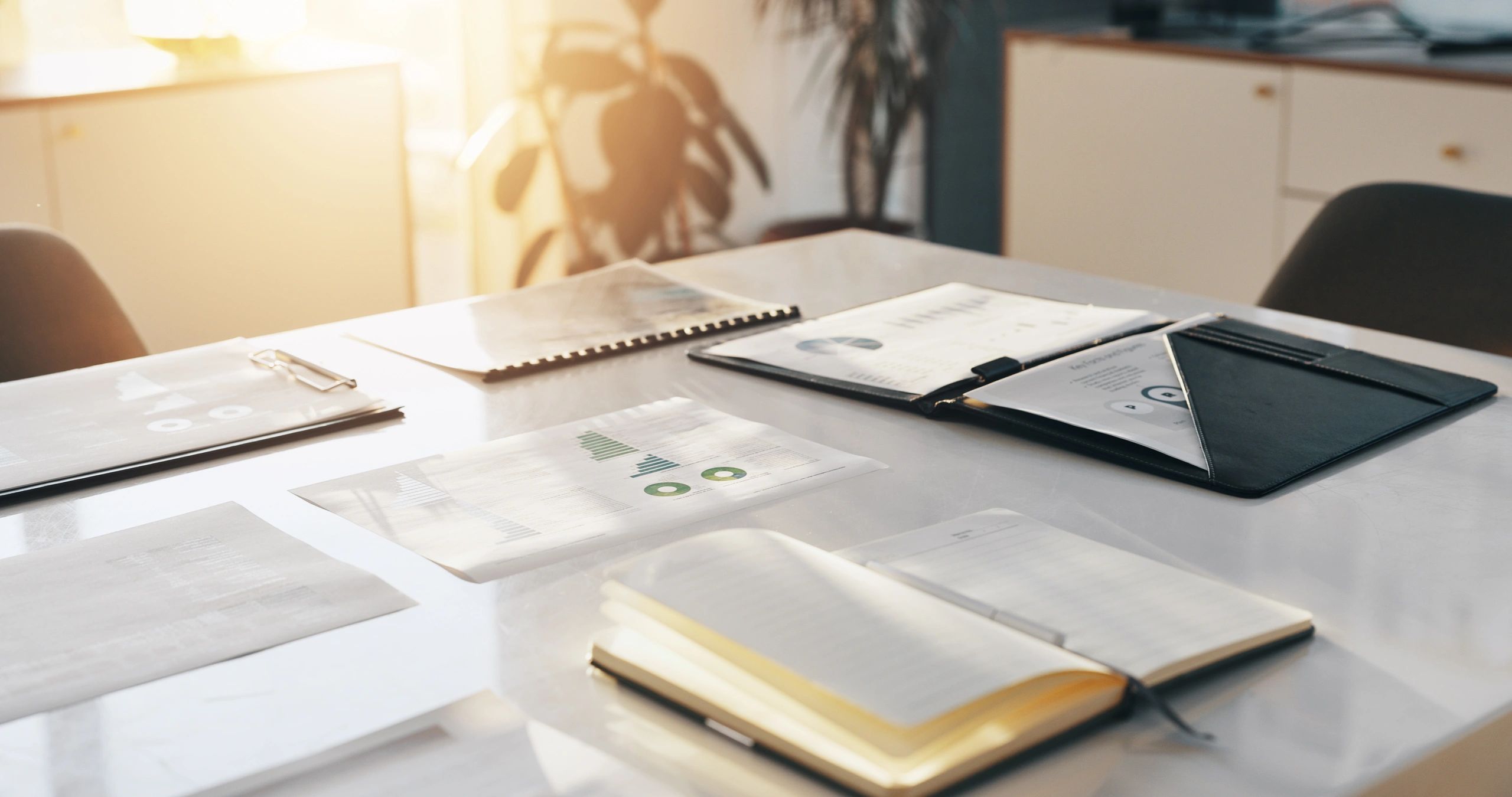 Desk with finance documents and notebook for budget planning